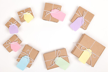 Christmas crafts paper holiday boxes on white background. Christmas winter holiday congratulation invitation birthday wedding. flat lay