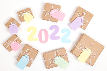 Christmas crafts paper holiday boxes on white background. Christmas winter holiday congratulation invitation birthday wedding. flat lay