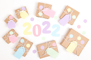 Christmas crafts paper holiday boxes on white background. Christmas winter holiday congratulation invitation birthday wedding. flat lay