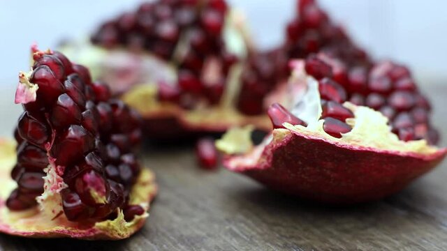 Fresh pomegranate seeds rotating in a platter