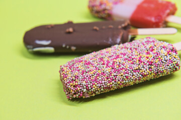 Set of ice cream on stick with colorful sprinkles