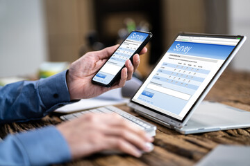 Businessman Giving Online Survey On Digital Tablet