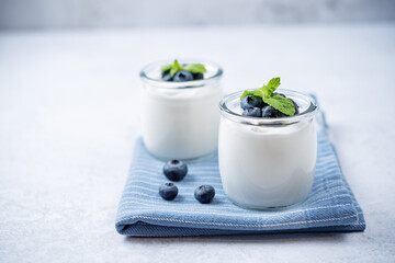 Greek yogurt blueberry parfaits with fresh berries and mint leaves