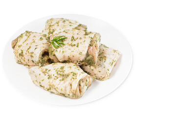 Raw marinated chicken thighs in sauce on a white isolated background. Top of view.Raw chicken marinated.Retail.Isolated object, copy space.Chicken semi-cooked thighs.