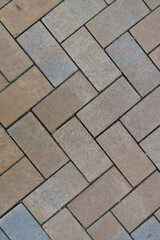 vertical color photo of a stone floor with interesting pattern as background photo