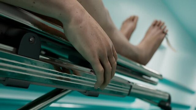 A dead man on a hospital bed. Corps on a gurney. Infection fatality of COVID-19