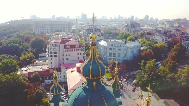 Aerial view of St. Andrew's Church dome and cross, historical center, Podil district, Dnieper river, Kiev, Ukraine. The architecture of Kyiv.
