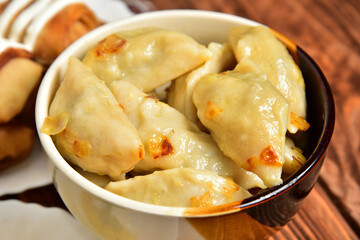 Home Ukrainian cuisine dumplings with filling in a plate