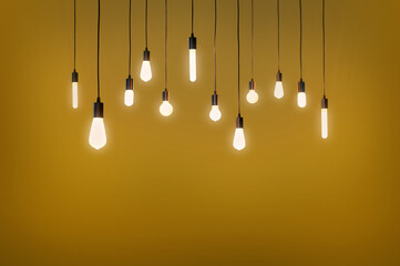 Bulbs electric and a light as a concept background 