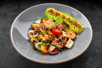 Seafood salad with avocado, shrimp, scallops, octopus