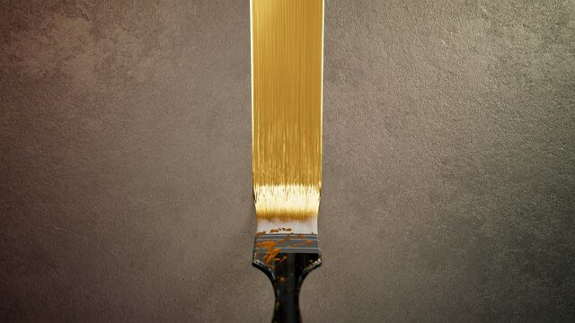 The brush painting process with decorative golden colour paint. Glamour style.