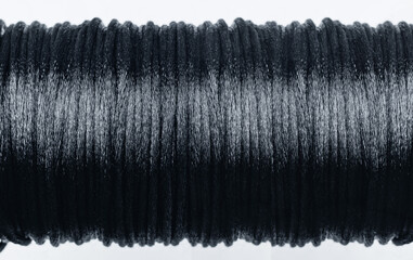 A fragment of a coil with a nylon thread