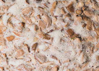The process of cooking mushrooms in a saucepan