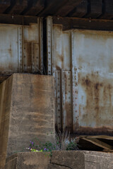 Fototapeta na wymiar Concrete and metal underside of a bridge.