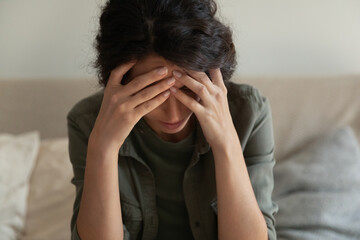 Concerned young woman thinking over personal problem, feeling depressed, anxious, panic attack, getting bad news, going through nervous disorder, emotional crisis. Mental health, depression concept