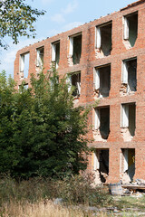 a destroyed building after an earthquake, a house without windows and doors