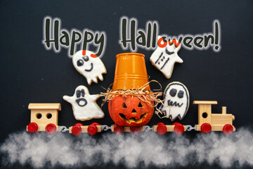 Halloween kids train toy Trick or Treat with pumpkin squash, ghost, skeleton cookies and sweets. Happy Halloween card