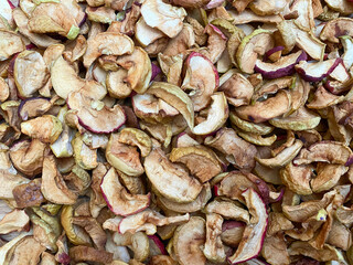 Background of dried apples in close-up. Texture of dried apples