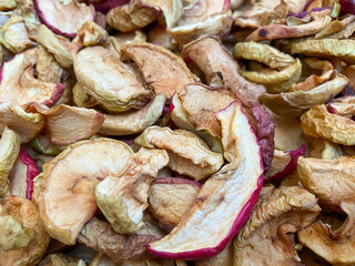 Background of dried apples in close-up. Texture of dried apples