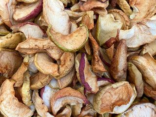 Background of dried apples in close-up. Texture of dried apples