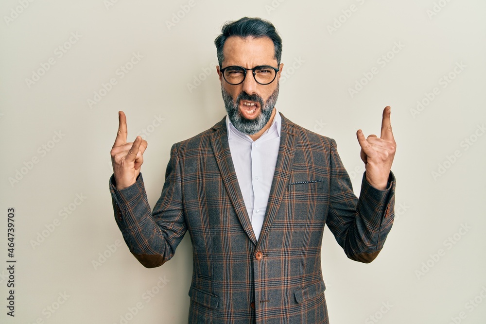 Sticker middle age man with beard and grey hair wearing business jacket and glasses shouting with crazy expr