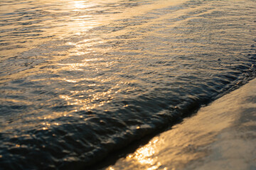 blur sunlight plays on the river ripple surface. sunset water surface. water background. blue and sunny water surface. abstract blue water