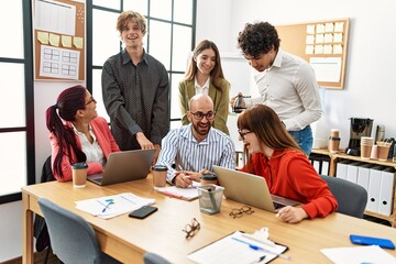 Group of business workers smiling happy working at the office.