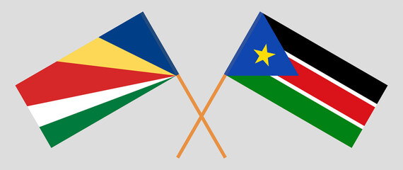 Crossed flags of Seychelles and South Sudan. Official colors. Correct proportion