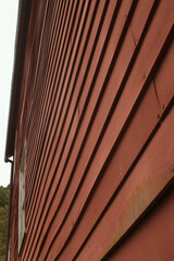 Red siding on old building