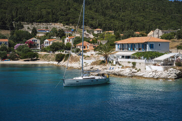 Fototapeta na wymiar Sailing boats anchored at Fiscardo village in Kefalonia island, Greece