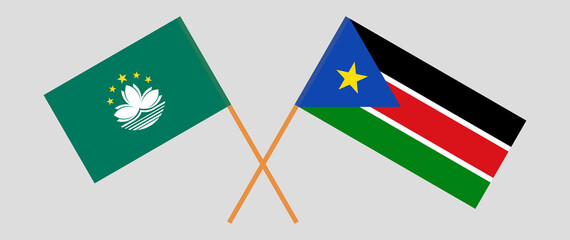 Crossed flags of Macau and South Sudan. Official colors. Correct proportion
