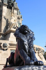 Obraz premium Lion statue in the Columbus monument in Barcelona, Spain