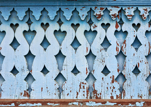 Detailed texture of painted old blue carved platbands