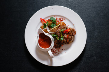 Grilled pork with potatoes. Fried meat with sauce.