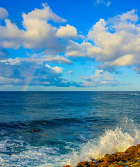 beautiful mediterranean sea with wave, clouds and rainbow in turkey