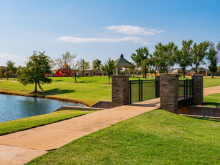 Fototapeta premium Sunny view of a beautiful community trail and envirnoment, trail