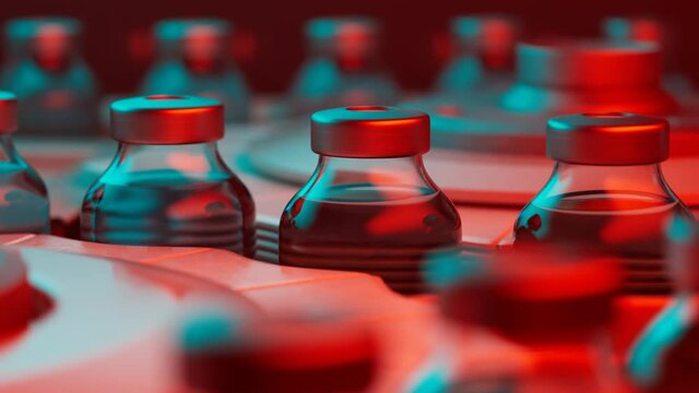 Glass vials with red liquid arranged in rows under red cyan light