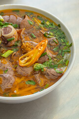 Close up photo of traditional Vietnam noodles Bun Bo Hue