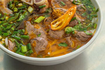 Close up photo of bun bo hue - famous Vietnamese food