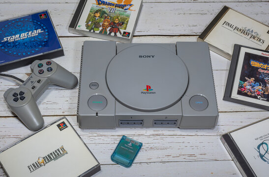 Fukuoka, Japan - october 24, 2021 : the original sony playstation 32-bit home video game console released in 1994 with some games and controller