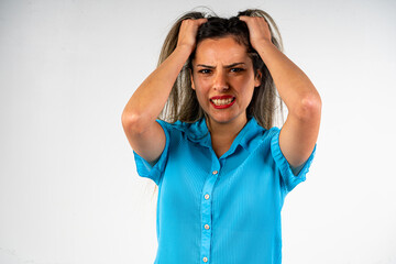 Beautiful young woman with an expression of frustration and anger, screaming and teasing.