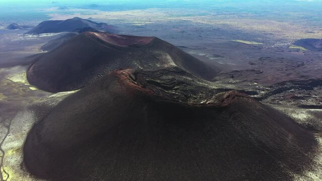 Volcano craters and black lava fields near Tolbachik volcano. Northern eruption craters, Kamchatka peninsula, Russia
