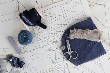 Set of tools for sewing clothes and acessoires on the table,top view.