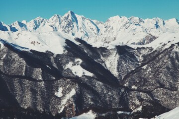 Pyrenees Snow covered mountains in winter. Ski chalet. Snow hiking. Cars covered in snow. France