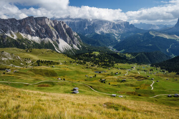 Fototapeta na wymiar Hiking path and epic landscape of Seceda peak in Dolomites Alps, Odle mountain range, South Tyrol, Italy, Europe