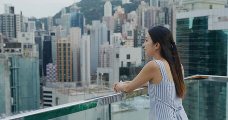 Fototapeta na wymiar Woman look at the city of Hong Kong
