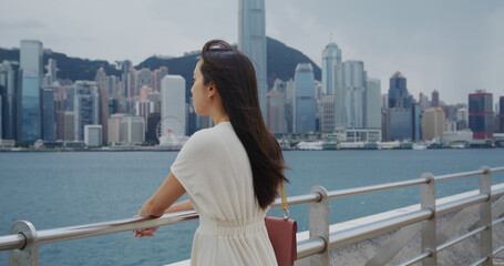 Fototapeta na wymiar Woman look at the city of Hong Kong