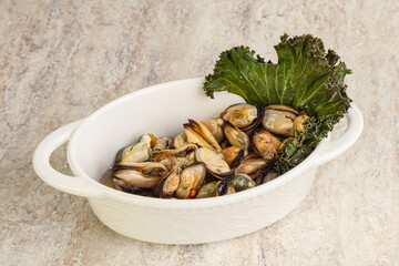 Tasty marinated mussels in the bowl