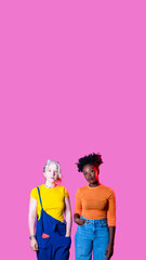 Two diverse women friends posing isolated advertising copy space background
