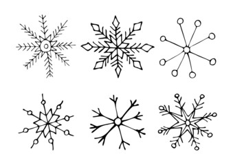Obraz premium A hand-drawn set of snowflakes of different shapes.